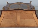 an image of a wooden bed sitting on top of a hard wood floor