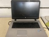 a laptop that is sitting on a table with a mouse