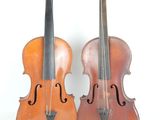 une paire de violons anciens sur fond blanc