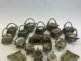 a lot of pottery items that are sitting on a table
