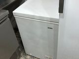 a refrigerator and a freezer in a kitchen
