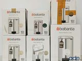 several boxes of brabantia coffee machines sitting on top of a table