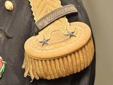 a military uniform with a badge on it