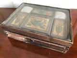 a wooden box with a glass top on a table