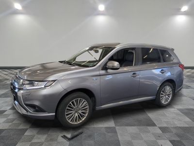 a picture of a silver car in a showroom