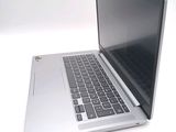 a laptop computer sitting on top of a white table
