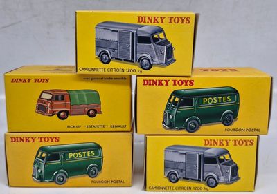 three boxes of dinky toys are stacked on top of each other