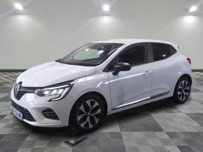 a white car is parked in a room with a checkered floor