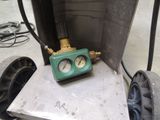 a picture of a green and black clock sitting in a box