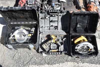 many tools and tools in a box on the ground