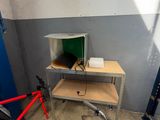 a bike that is parked next to a table in a room