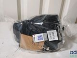 a bag of black yarn wrapped in plastic on a table