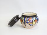 an image of a small vase with a lid