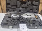 a tool in the case that is sitting on a table