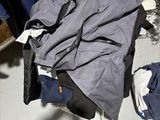 a pile of clothing on the floor in a room