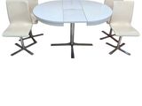 a white table with four chairs and a white table with four chairs