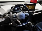 a steering wheel and dashboard of a car on display at a car show