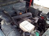 a small engine in the back of a truck