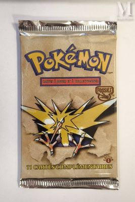 a close up of a packet of pokemon cards on a table