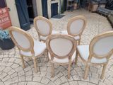 four chairs sitting in a circle on a brick patio