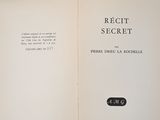 opened book with black and white text on it on a gray surface