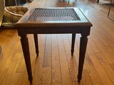 hardwood flooring in a living room with a table and chairs