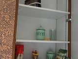 a cabinet with a lot of items on top of it