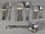 a lot of silver spoons and spoons on the table