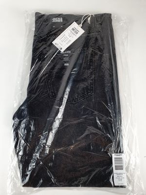 the back of a pair of black pants wrapped in plastic