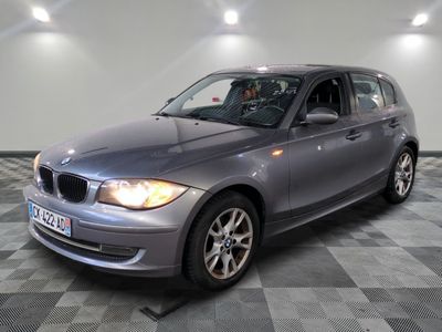 a picture of a silver car parked in a garage