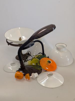 a white table with a bunch of glass vases on top of it