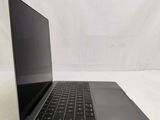 an open laptop computer sitting on top of a white surface