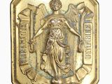 an image of a gold medal with a woman holding a sword