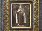 un tableau représentant une femme tenant un enfant dans un cadre en or