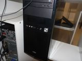 a black computer tower with a keyboard and mouse on top of it