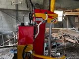a red and yellow machine that is sitting in a building