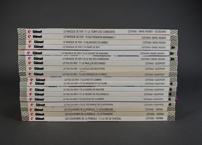 a lot of books that are stacked on top of each other