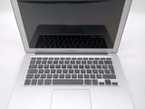 a laptop computer that is sitting on a white table