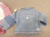 a denim jacket with a star on the back of it