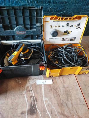 an image of a tool box with tools in it sitting on a wooden floor
