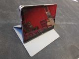 a laptop computer sitting on top of a table