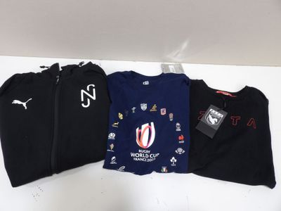 three t - shirts with different designs on them on a table