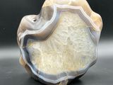 a picture of a piece of agate on a black surface