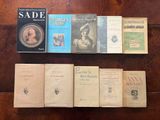 several books are lined up on a table in a row