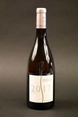 a bottle of wine that is sitting on a table