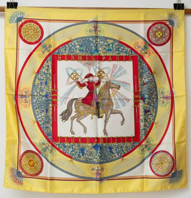 an image of a yellow scarf with a picture of a man on a horse