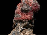 an image of a sculpture of a hat on top of a rock