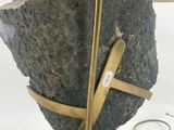 a lamp that has a rock on top of it