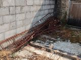 a building that has a lot of rust on the ground