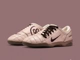 a close up of a pair of white shoes with black laces